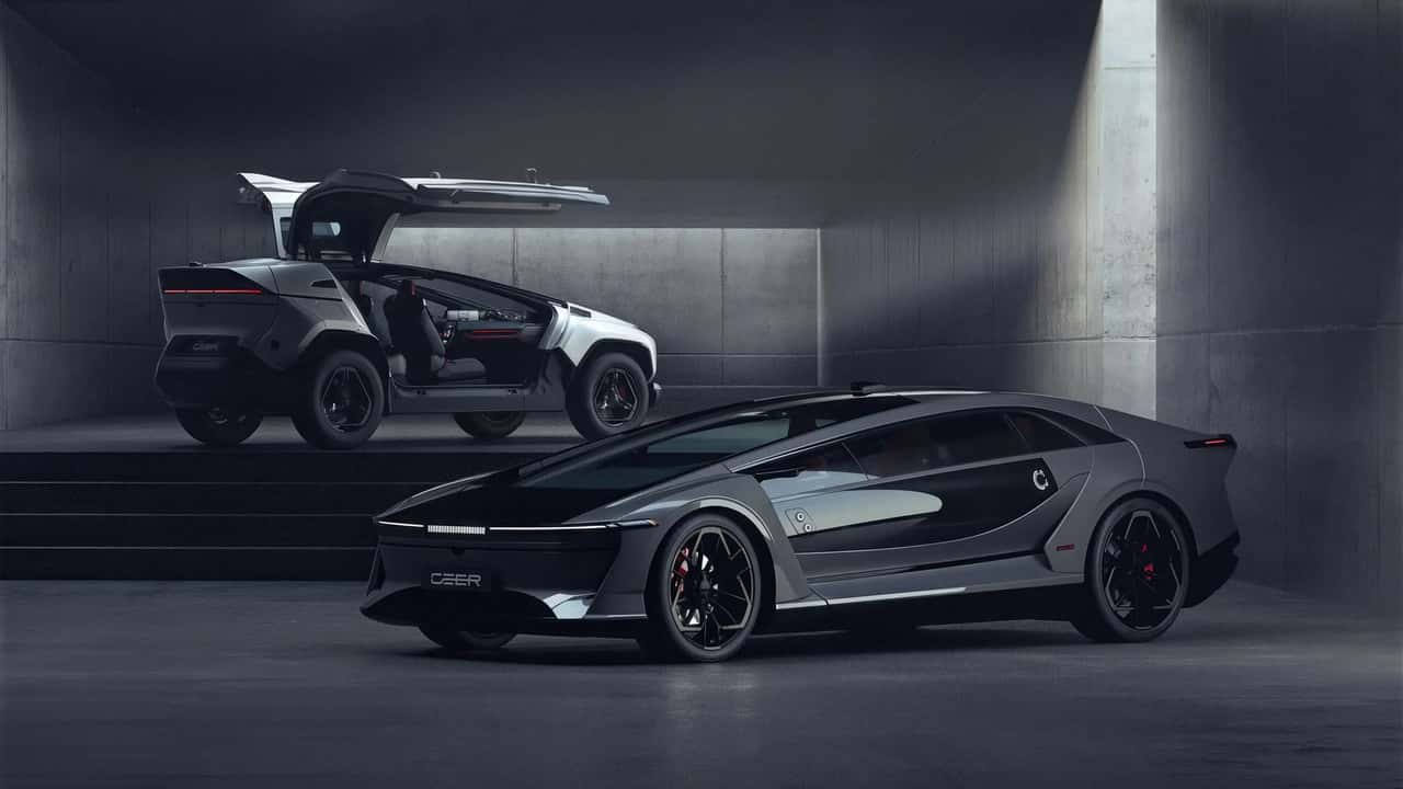Two CEER electric vehicles in a concrete studio